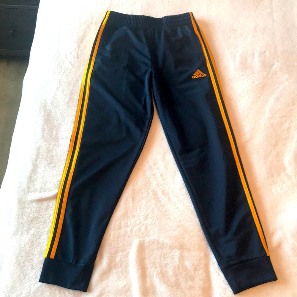 Brand new Adidas sweatpants. Medium 10-12 Navy blue and gold. Excellent condish!